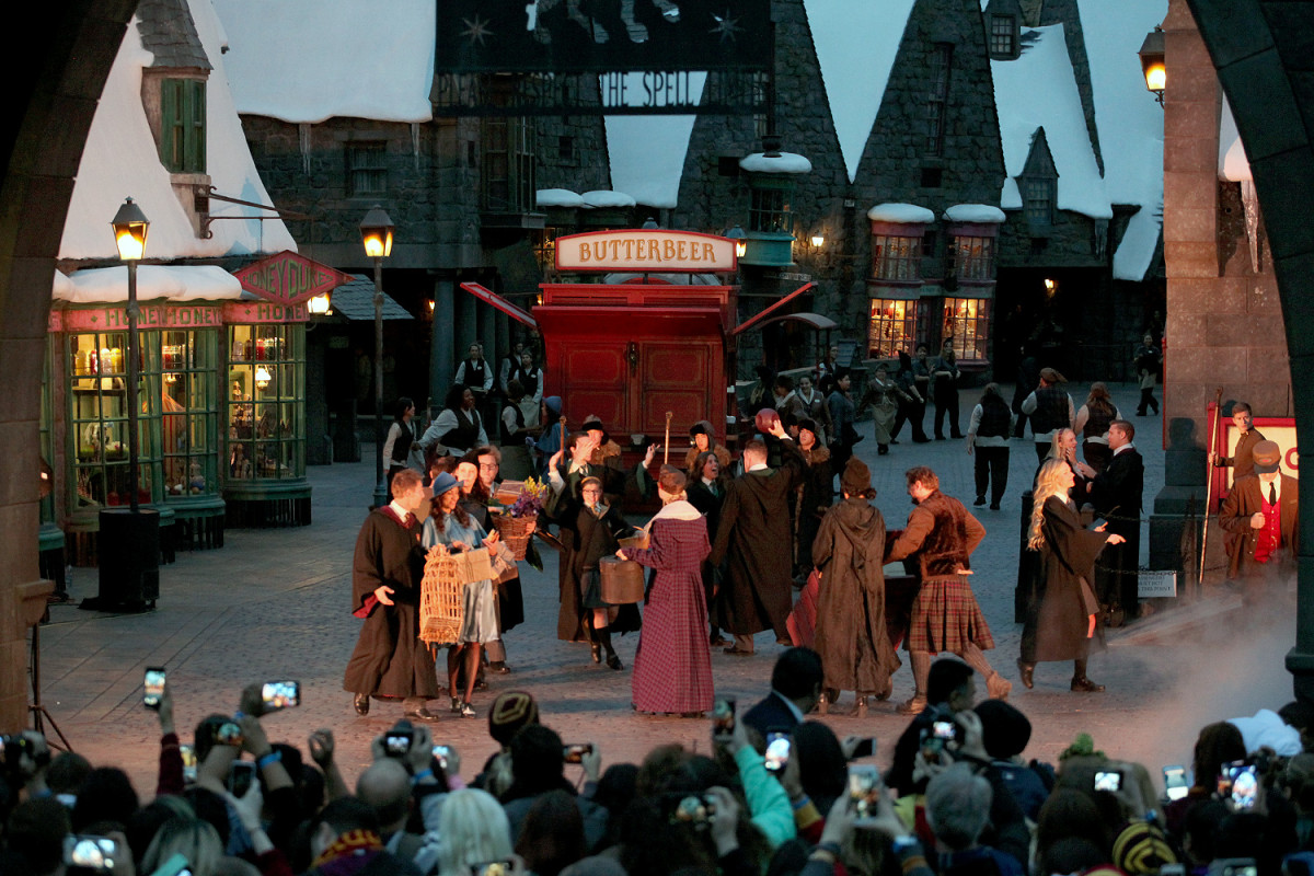 The fog rolls away to reveal a lively and bustling Hogsmeade at The Wizarding World of Harry Potter Grand Opening - April 7, 2016 - Photo by: David Yeh