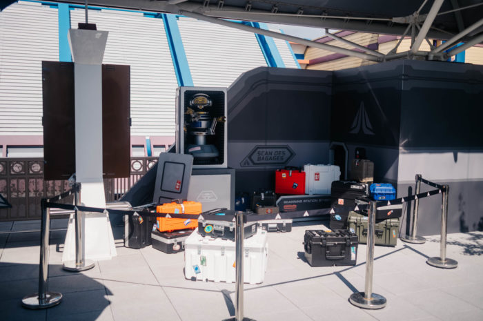 Captain Rex in a cardboard box surrounded by crates